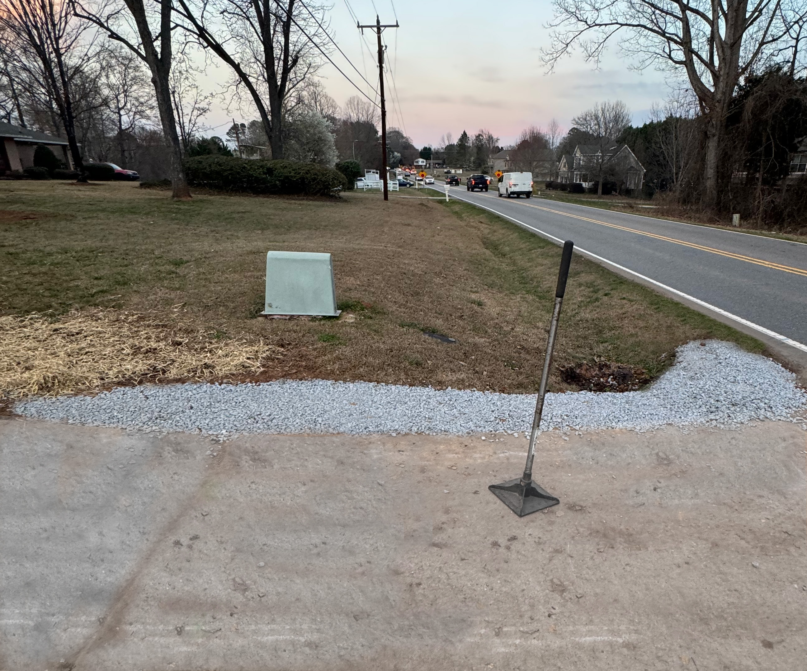 Gravel edge installation along driveway